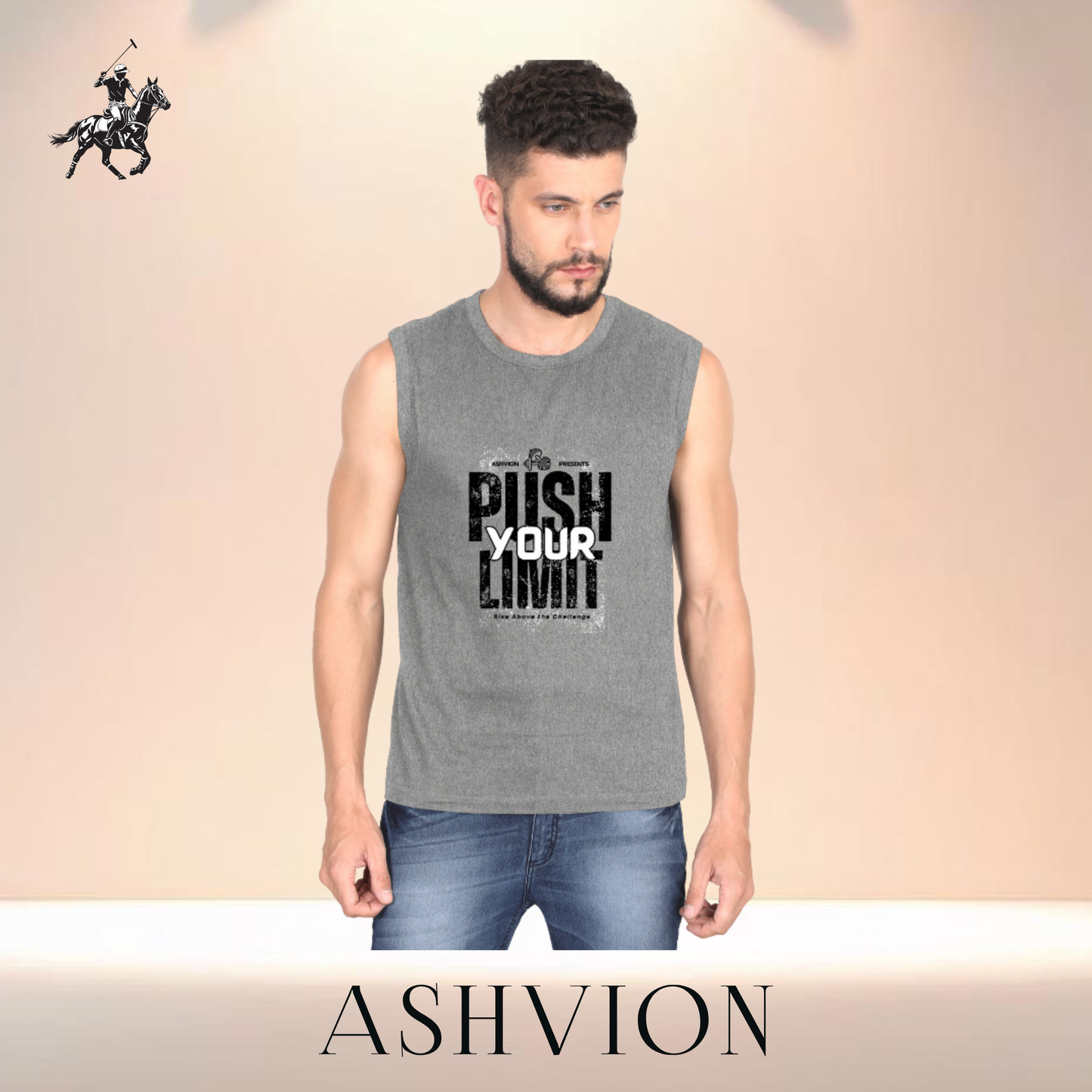 Man wearing a sleeveless gray shirt with text and jeans, standing against a beige background with Ashvion branding.