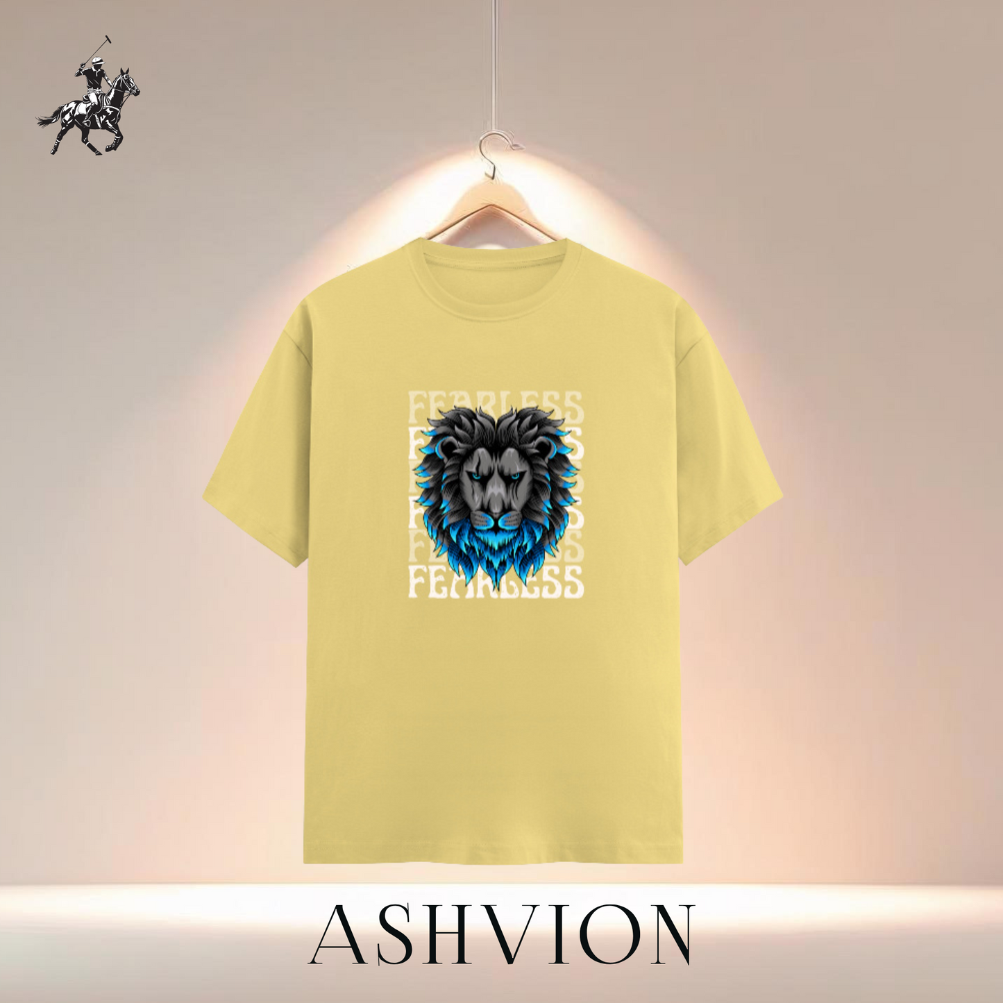 Yellow t-shirt with a blue lion graphic and text on a hanger against a neutral background, featuring the brand 'ASHVION'.
