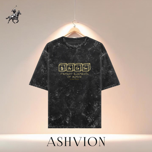 Black marble-textured t-shirt with yellow text on a hanger against a neutral background, featuring the brand 'ASHVION'.