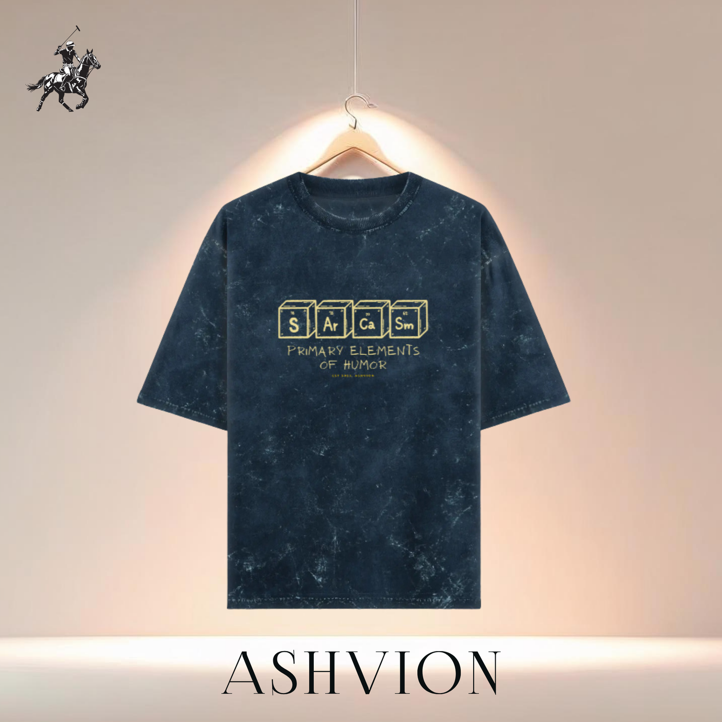 Blue t-shirt with text on a hanger against a neutral background, featuring the brand 'ASHVION'.