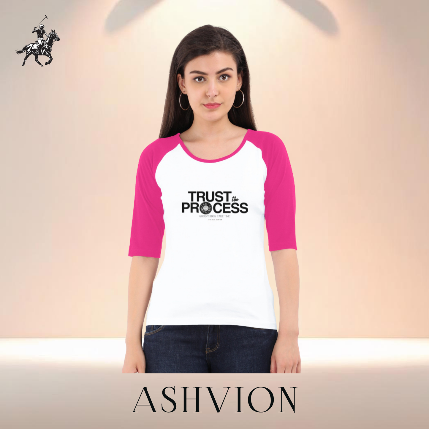 Woman wearing a white and pink 'Trust the Process' t-shirt with Ashvion branding.